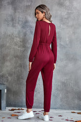 Combinaison à manches longues et col rond avec cordon de serrage à la taille